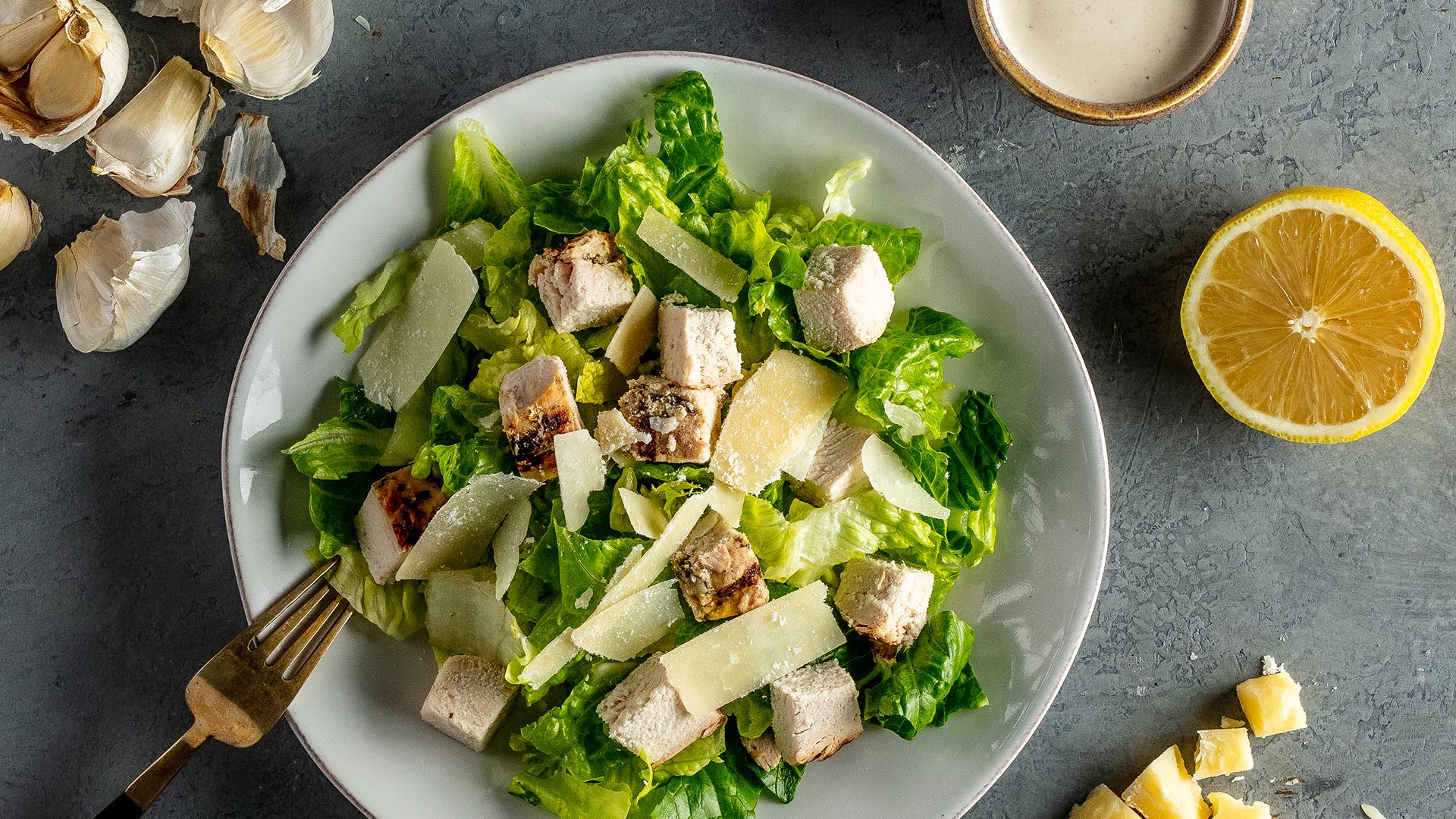 chicken caeser salad in bowl