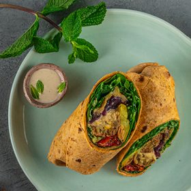 falafel vegetable whole wheat wrap prepared on plate