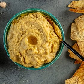 hummus and pita chips in bowl