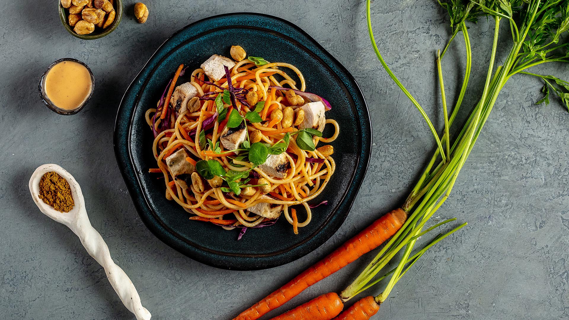 sesame chicken noodle bowl on plate